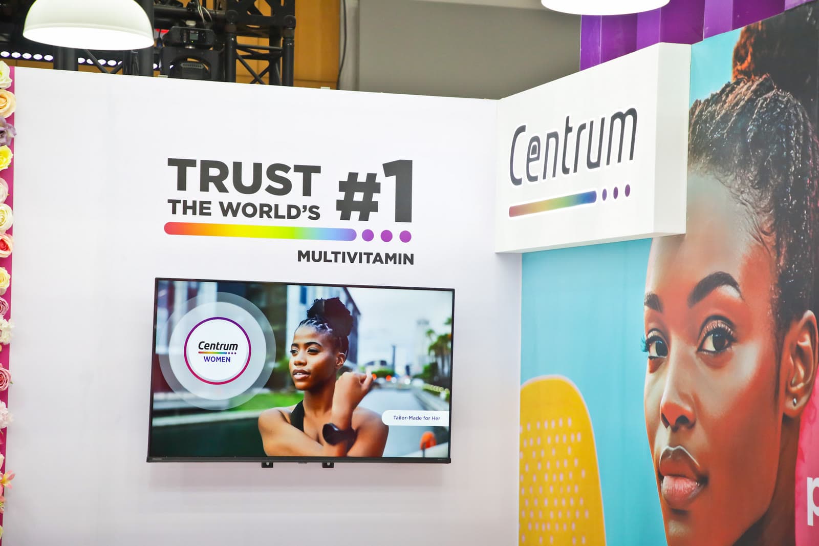 The Centrum “Trust the world's #1 multivitamin” wall with screen content